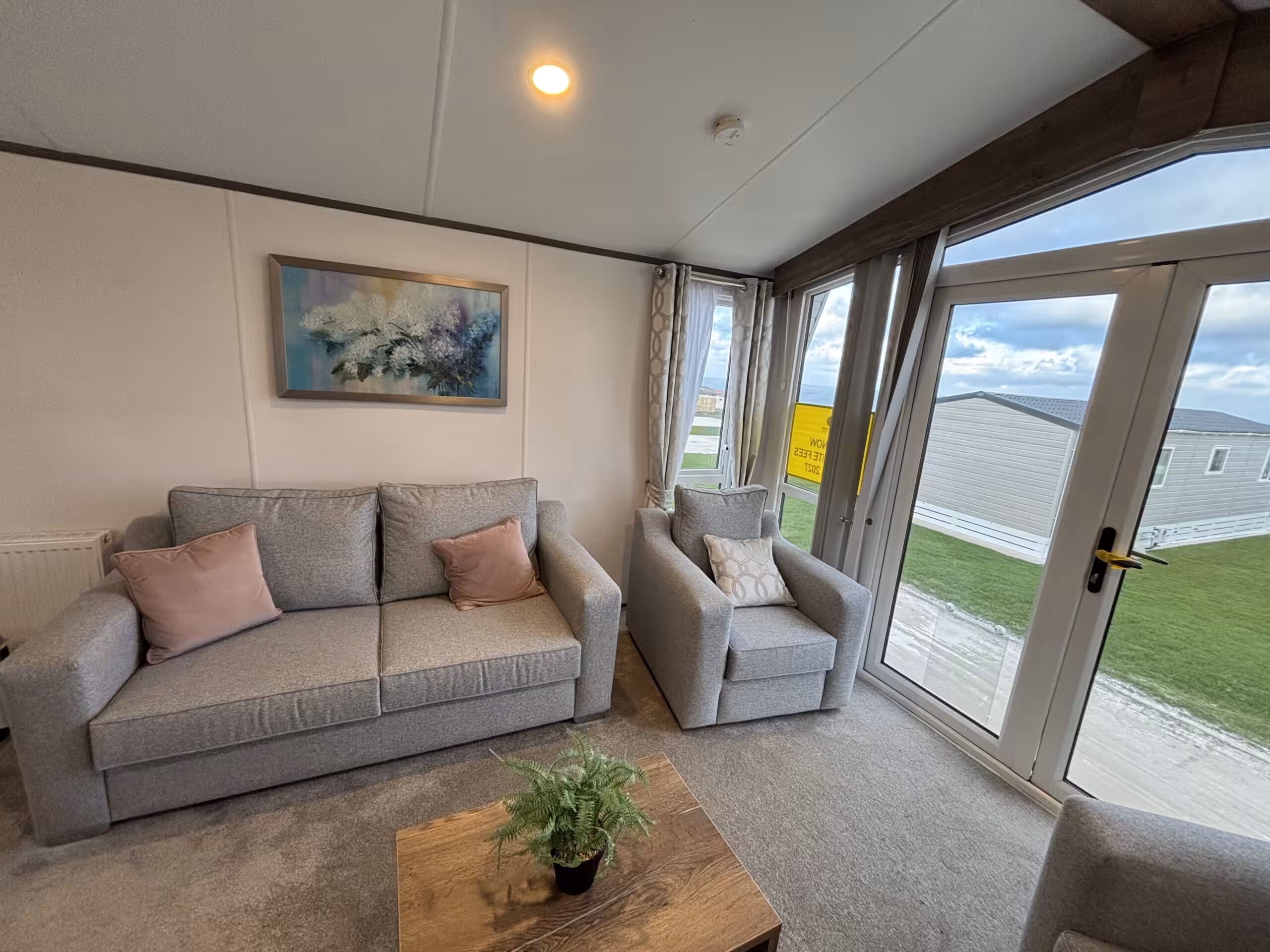 Living room area in the 2023 Atlas Status on sale at Elm Bank Coastal Park in Berwick-upon-Tweed, Northumberland.