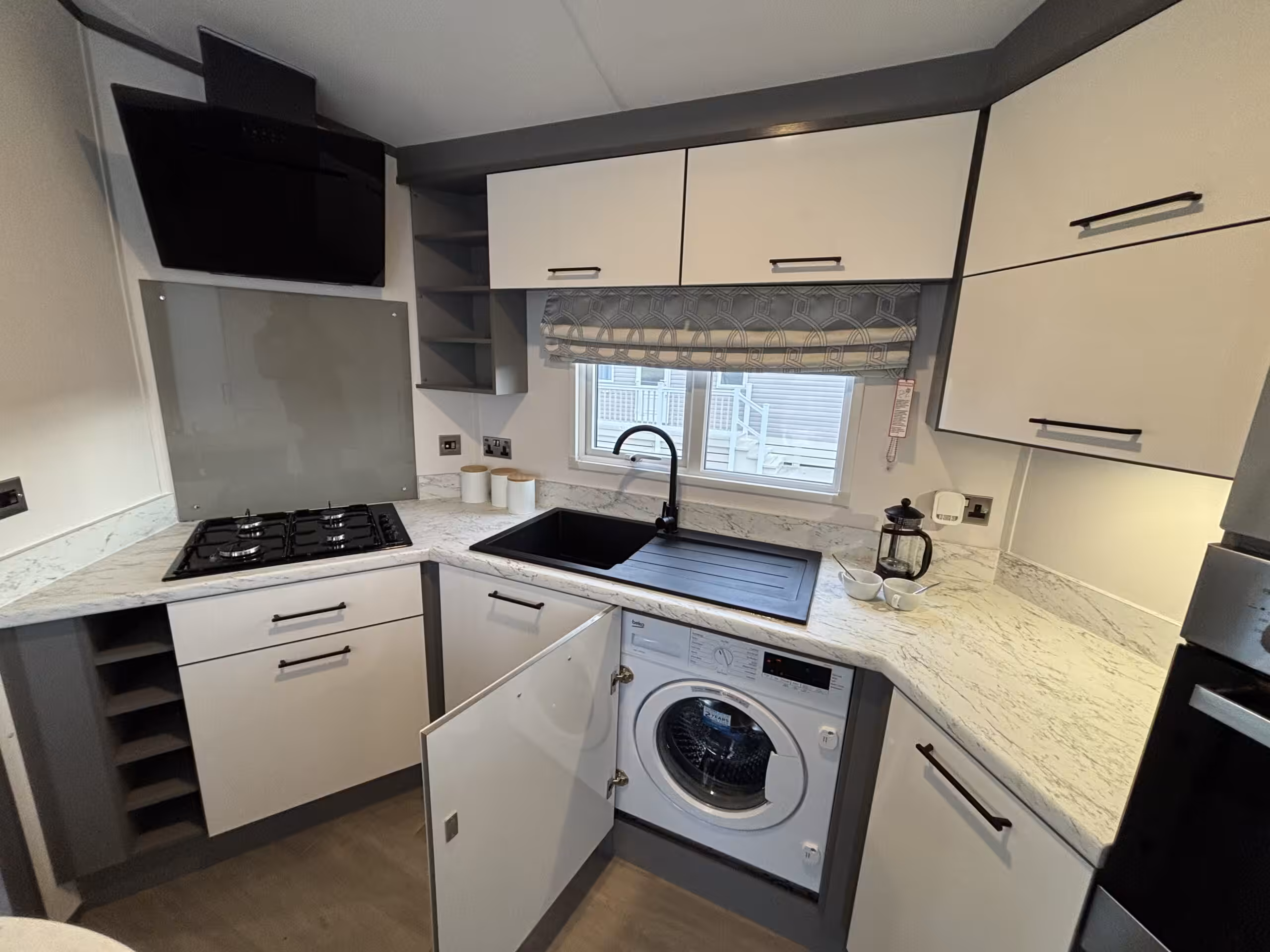 Kitchen area in the 2023 Atlas Status on sale at Elm Bank Coastal Park in Berwick-upon-Tweed, Northumberland.