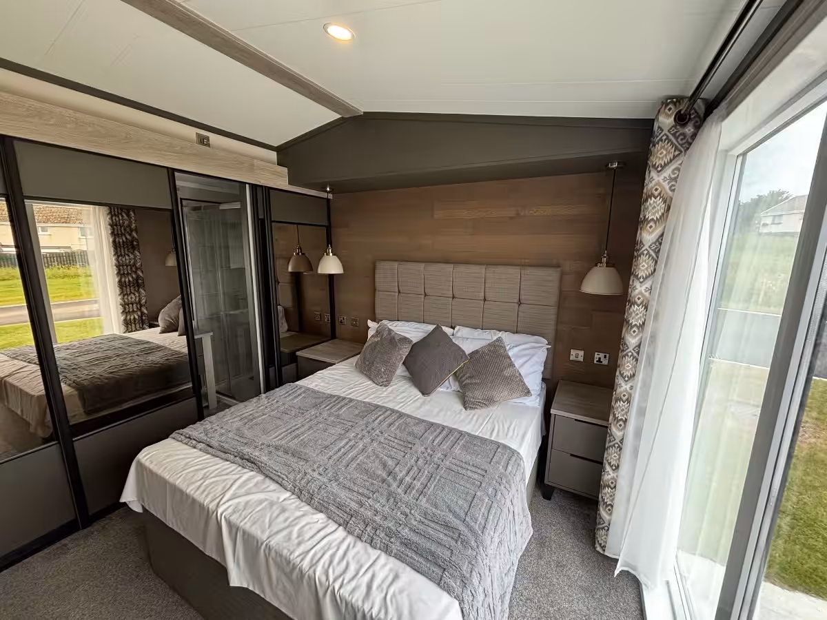 Master bedroom and storage in the 2021 Victory Lakewood Lodge for sale at Elm Bank Coastal Park in Spittal, Berwick-upon-Tweed, Northumberland.