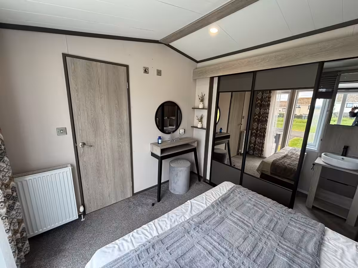 Master bedroom in the 2021 Victory Lakewood Lodge for sale at Elm Bank Coastal Park in Spittal, Berwick-upon-Tweed, Northumberland.