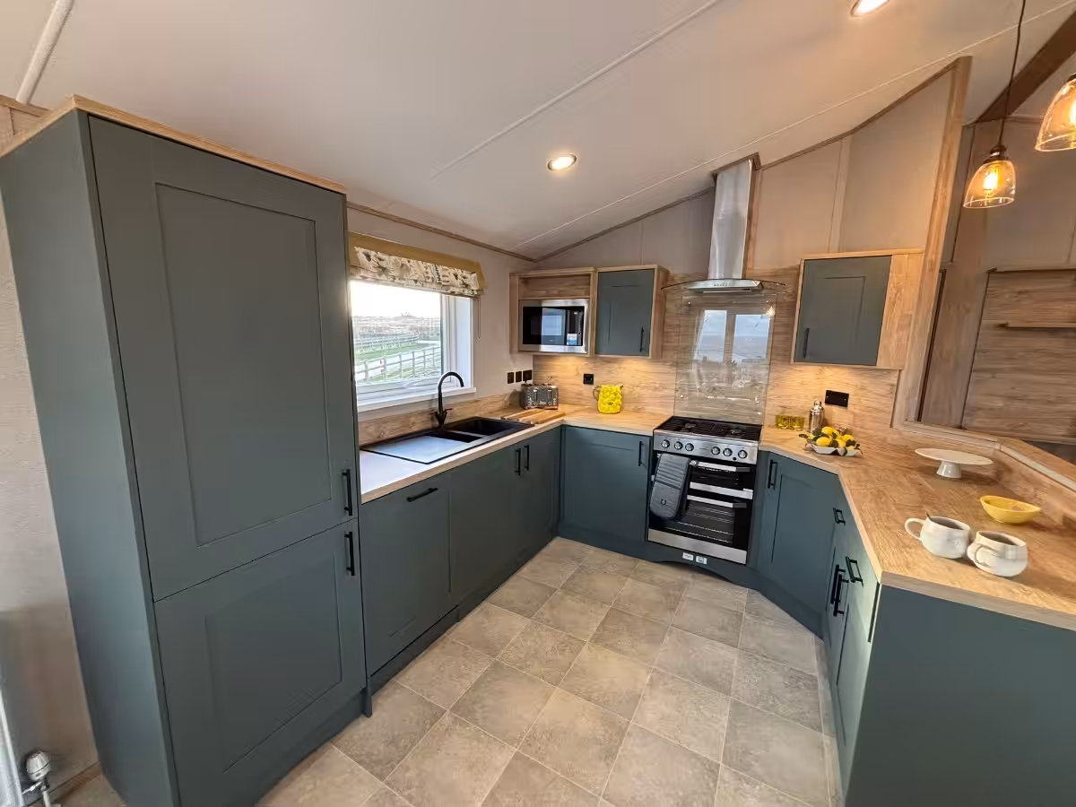 Wide angel view of kitchen in in 2026 ABI Kielder Lodge for sale at Elm Bank Coastal Park