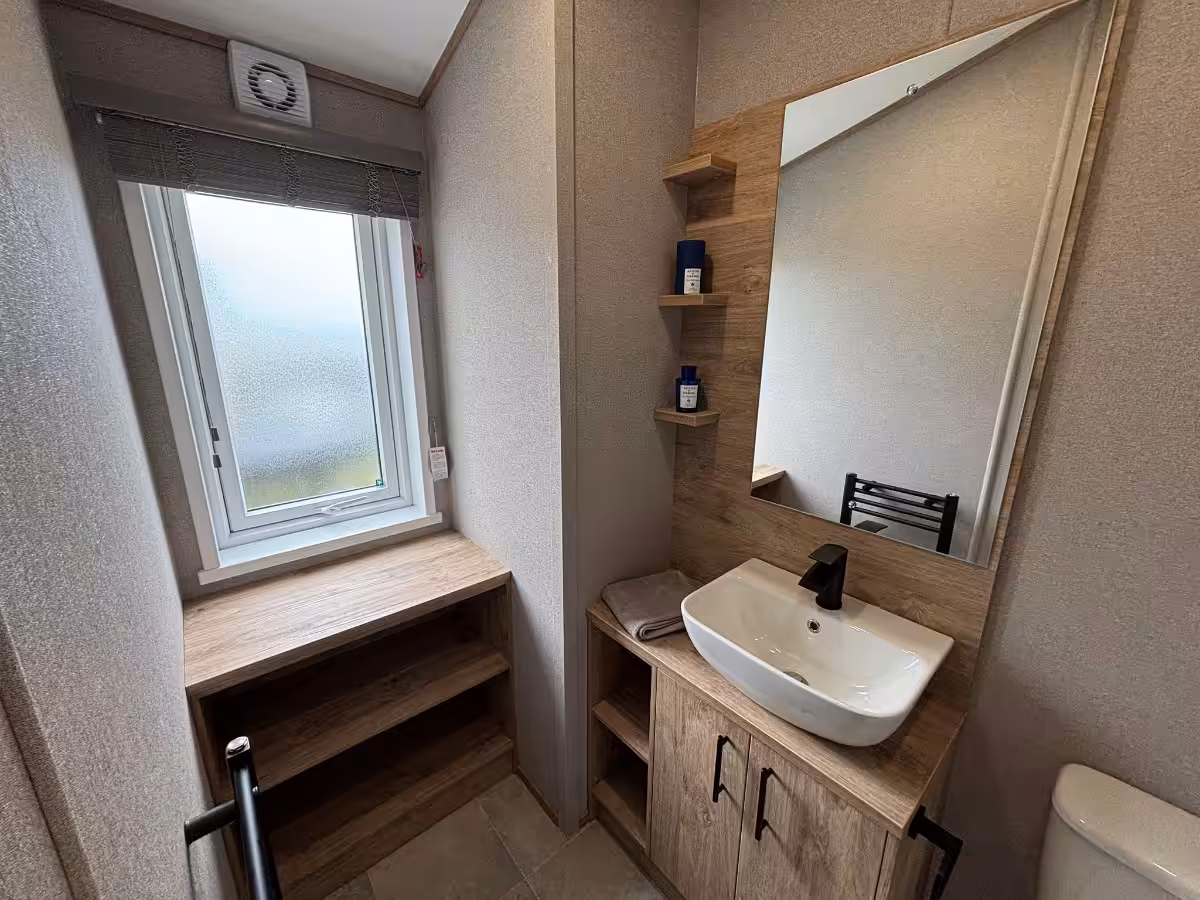 2026 ABI Kielder Lodge for sale at Elm Bank Coastal Park in Berwick, Northumberland - family shower room and basin