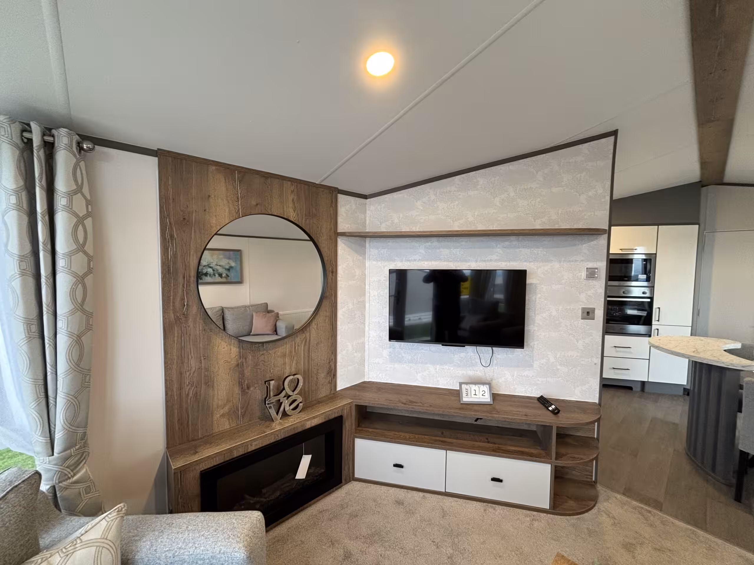 Living room area in the 2023 Atlas Status on sale at Elm Bank Coastal Park in Berwick-upon-Tweed, Northumberland.