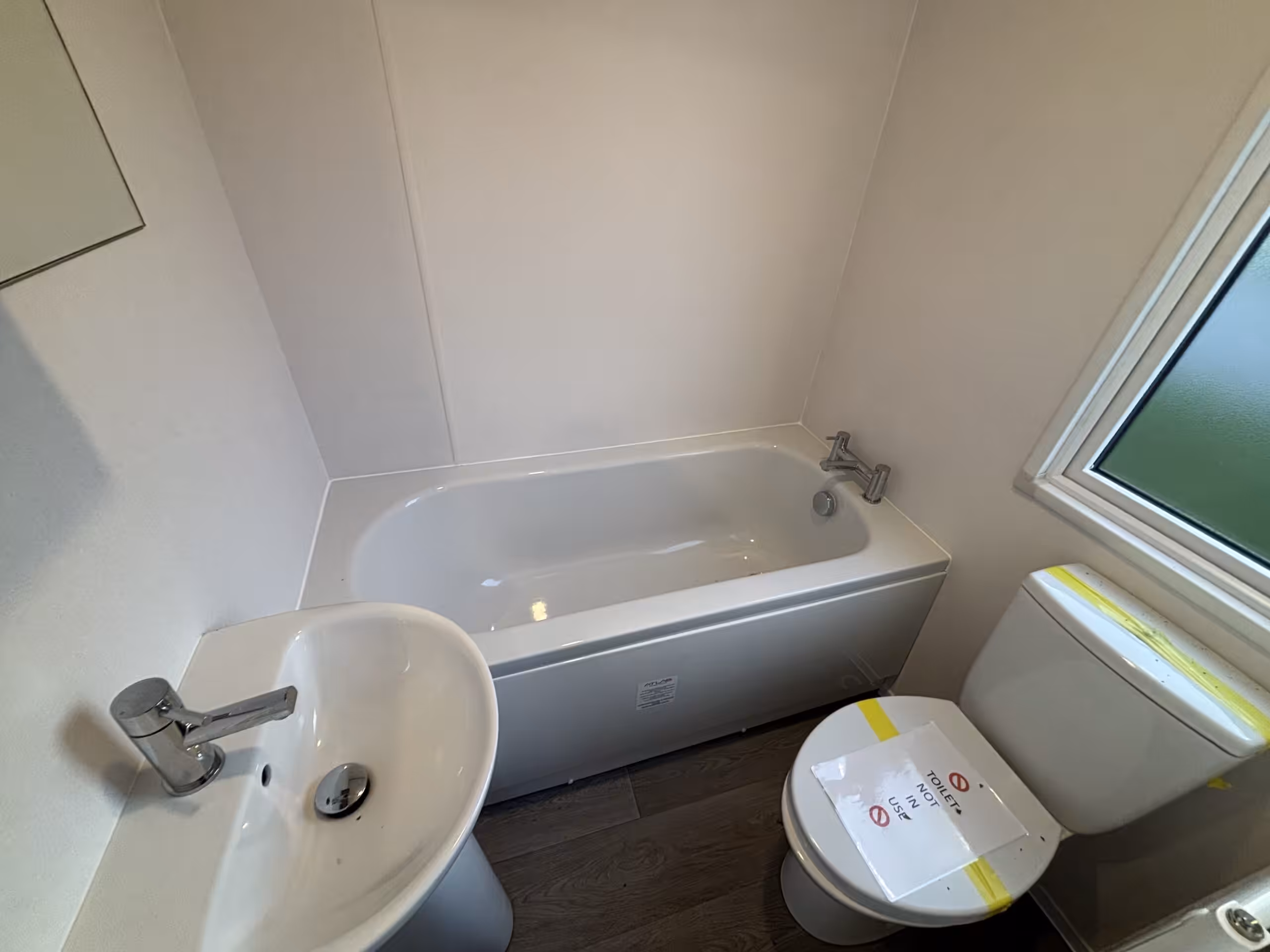 Bathroom in the 2023 Atlas Status on sale at Elm Bank Coastal Park in Berwick-upon-Tweed, Northumberland.