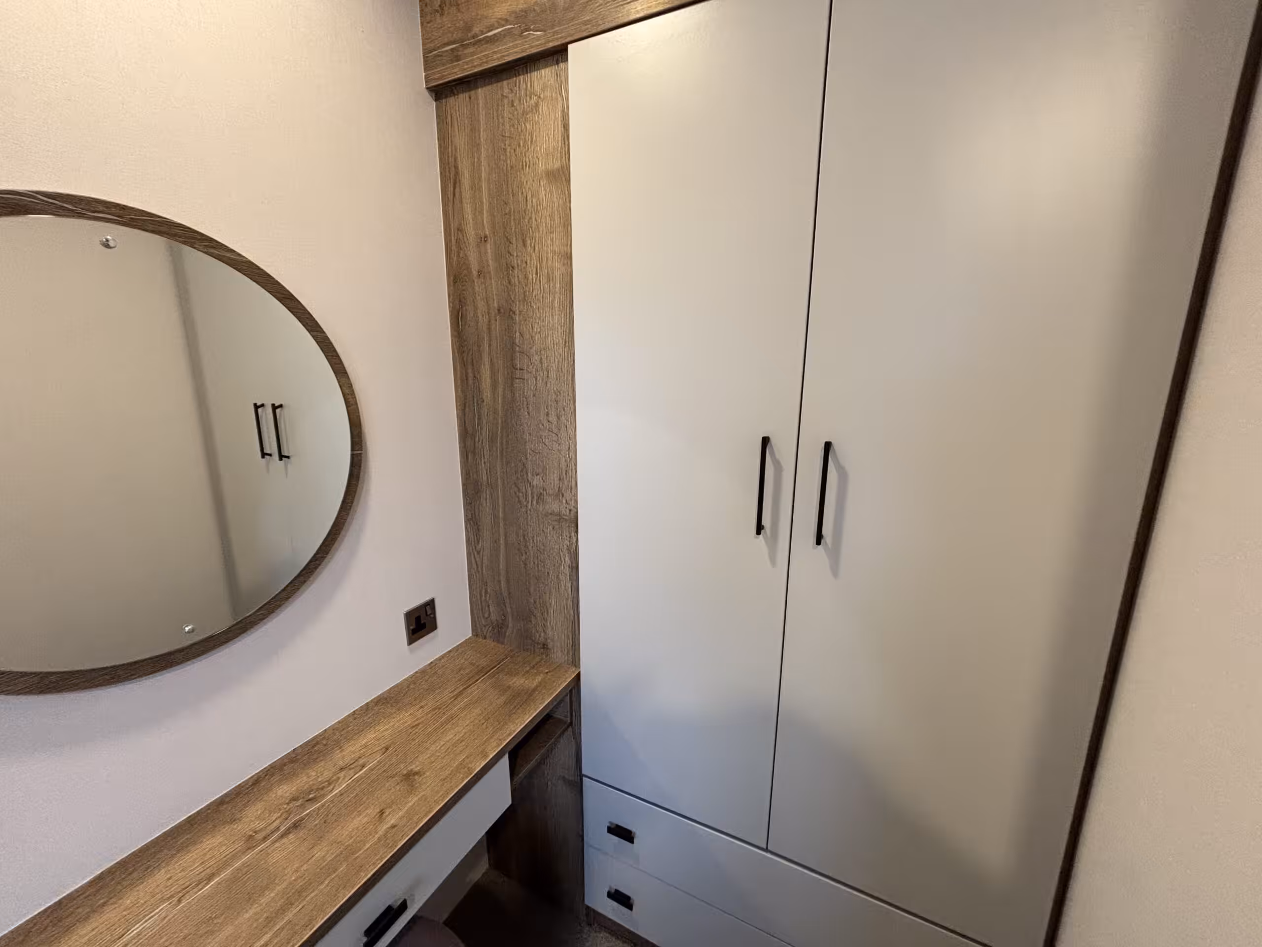 Bedroom vanity and storage area in the 2023 Atlas Status on sale at Elm Bank Coastal Park in Berwick-upon-Tweed, Northumberland.