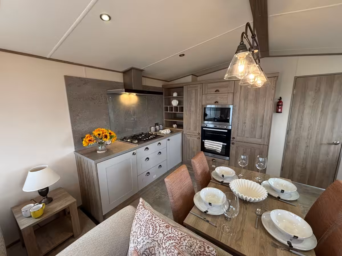 Kitchen and dining area in the 2021 ABI Adderstone Elite for sale at Elm Bank Coastal Park in Berwick, Northumberland.