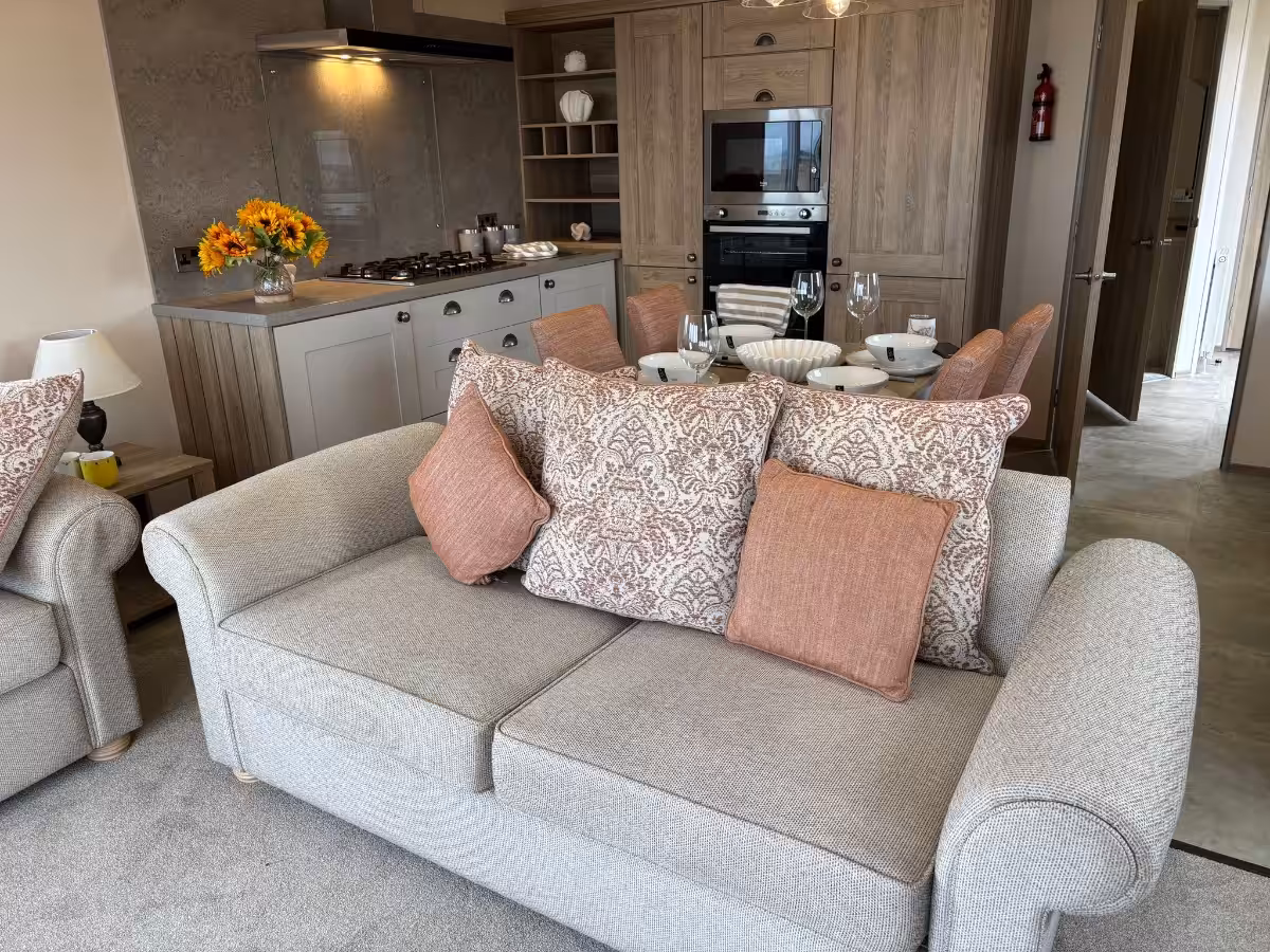 Free standing furniture in the living room of the 2021 ABI Adderstone Elite for sale at Elm Bank Coastal Park in Berwick, Northumberland.