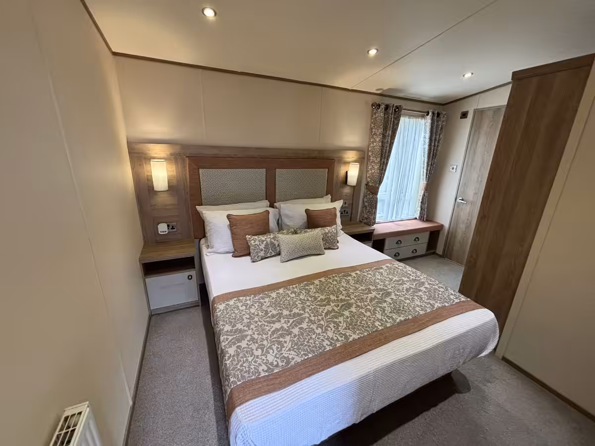 Wide angle view of master bedroom in the 2021 ABI Adderstone Elite for sale at Elm Bank Coastal Park in Berwick, Northumberland.