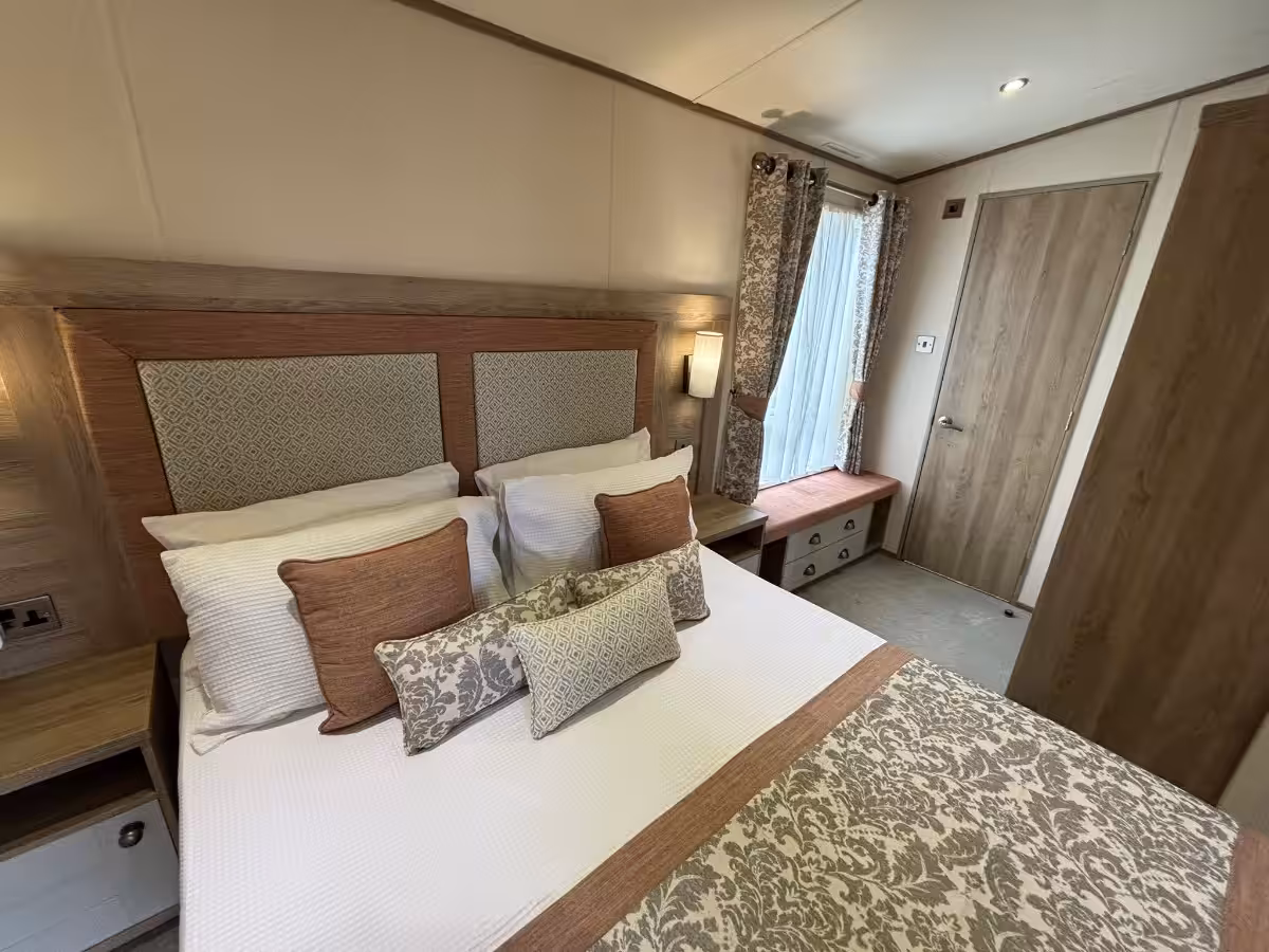 Spacious master bedroom in the 2021 ABI Adderstone Elite for sale at Elm Bank Coastal Park in Berwick, Northumberland.