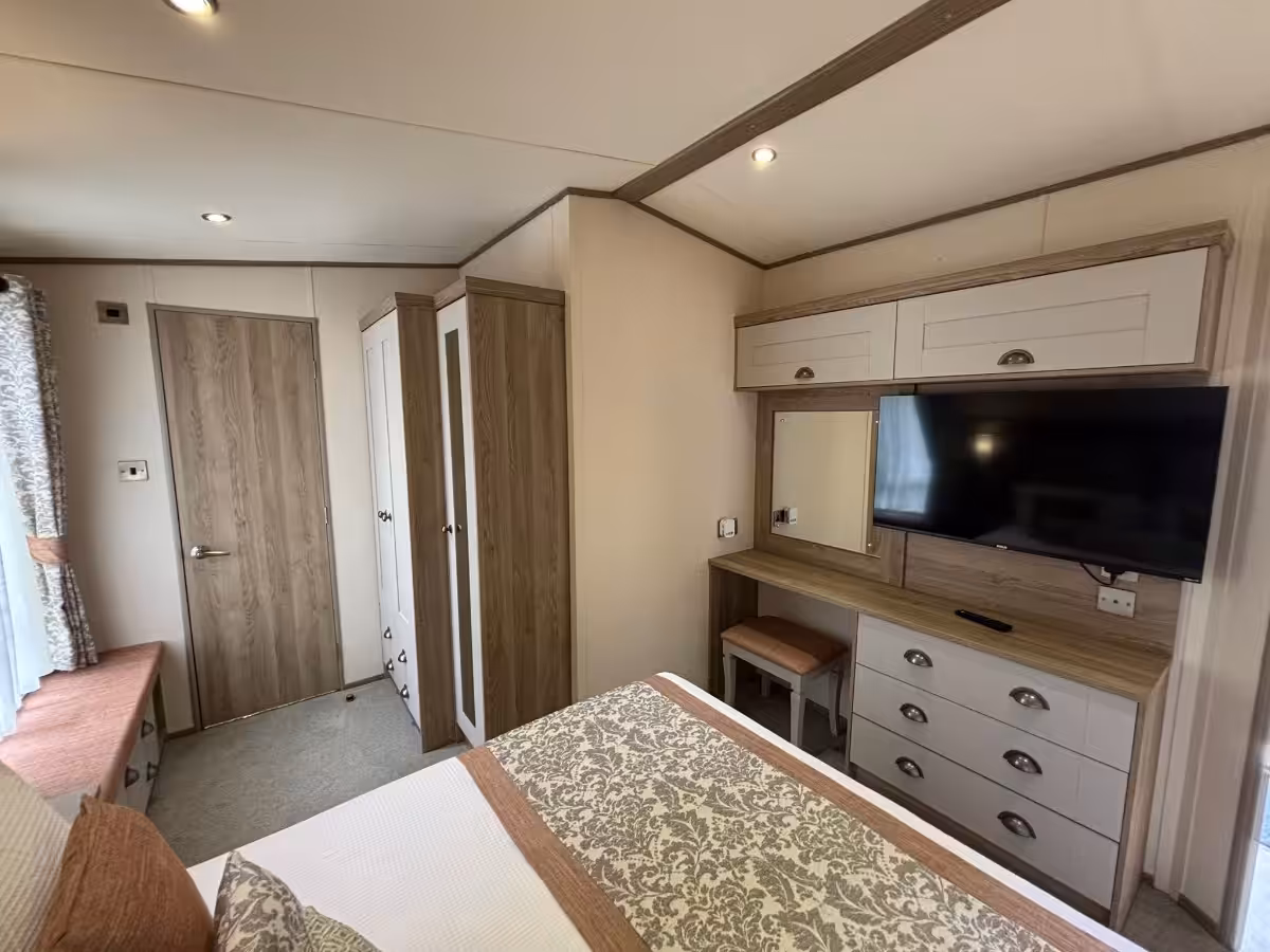 Master bedroom side view in the 2021 ABI Adderstone Elite for sale at Elm Bank Coastal Park in Berwick, Northumberland.