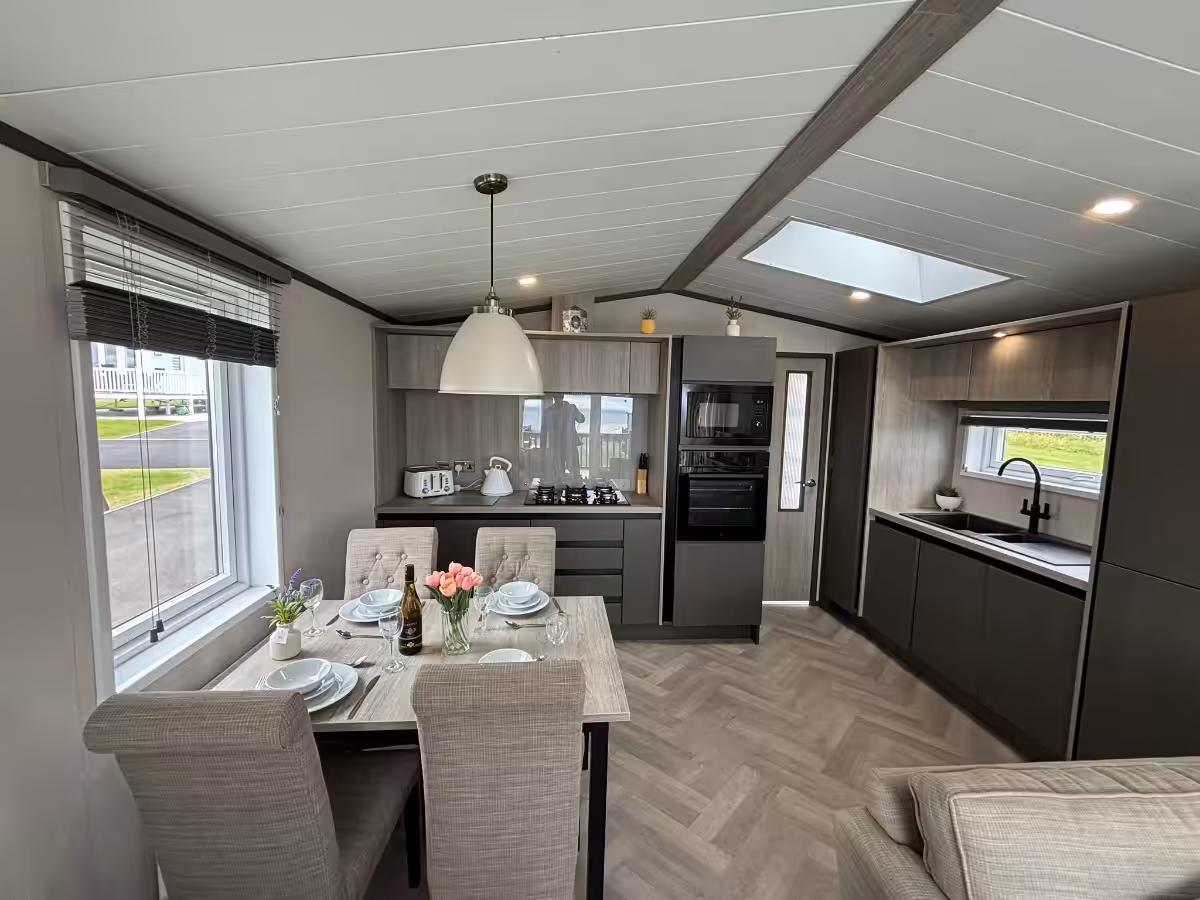 Dining room and kitchen in the 2021 Victory Lakewood Lodge for sale at Elm Bank Coastal Park in Spittal, Berwick-upon-Tweed, Northumberland.