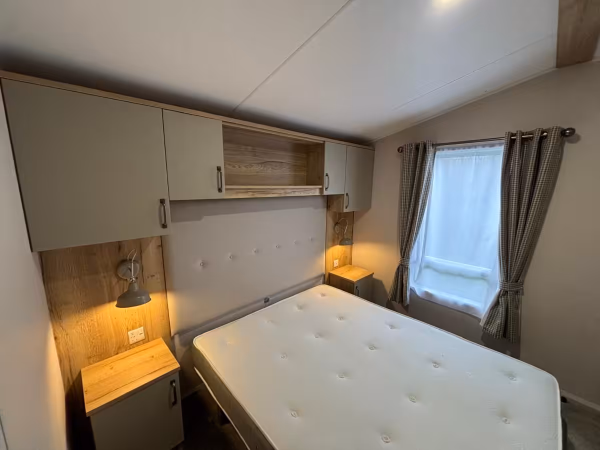 Master bedroom in the 2022 Atlas Debonair for sale at Elm Bank Coastal Park in Spittal, Berwick-upon-Tweed, Northumberland.
