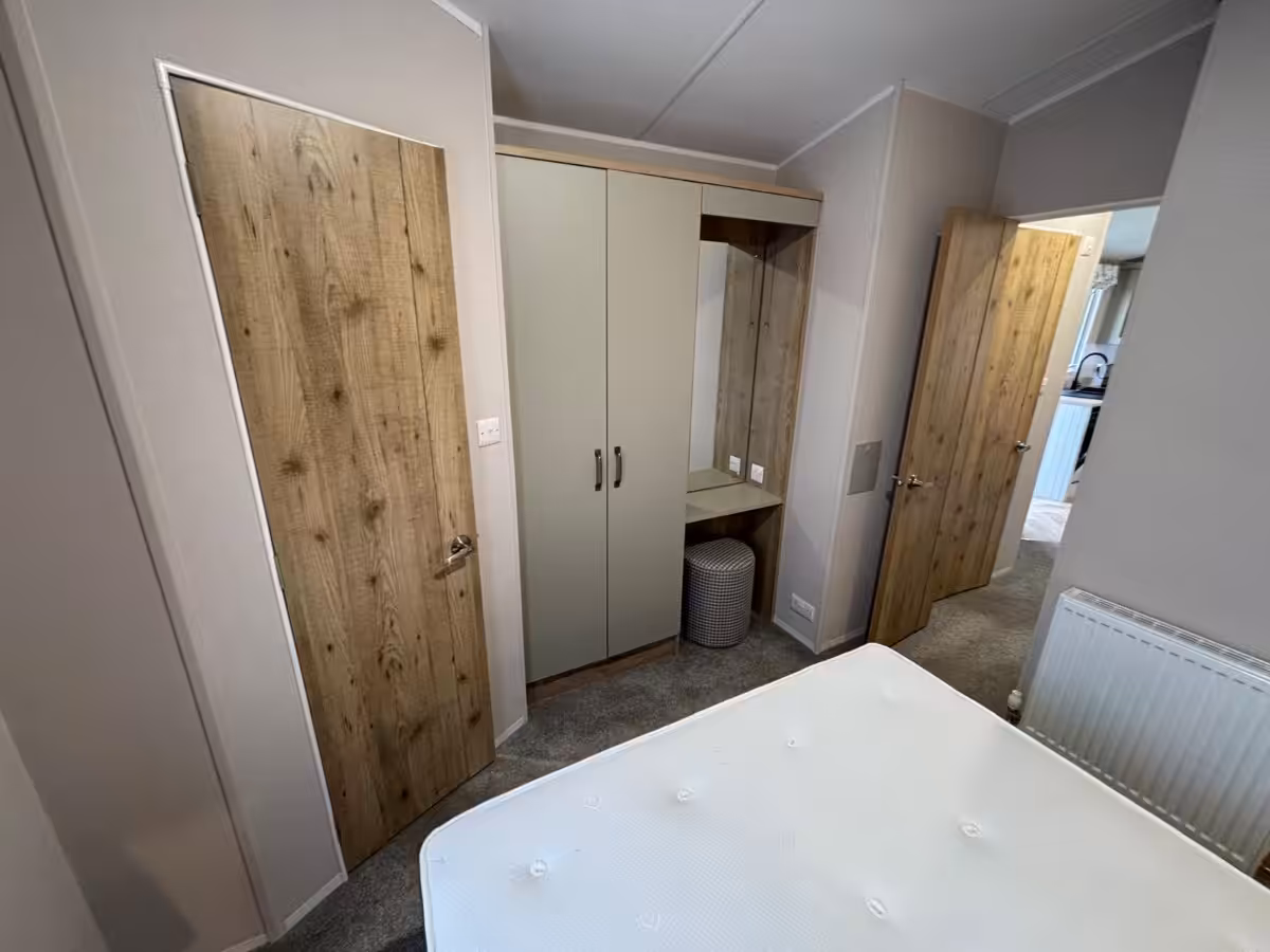 Master bedroom in the 2022 Atlas Debonair for sale at Elm Bank Coastal Park in Spittal, Berwick-upon-Tweed, Northumberland.