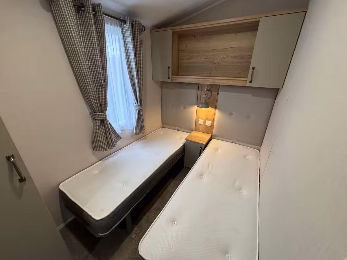 Twin bedroom in the 2022 Atlas Debonair for sale at Elm Bank Coastal Park in Spittal, Berwick-upon-Tweed, Northumberland.