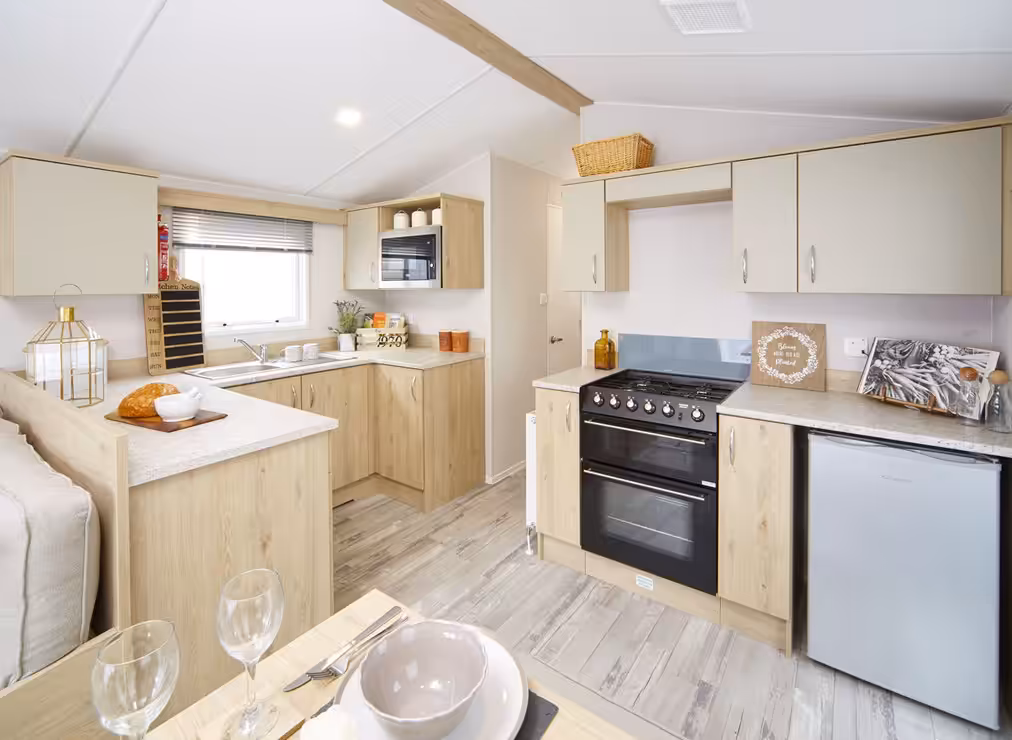 Kitchen and dining area in the 2021 Atlas Mirage for sale at Elm Bank Coastal Park in Spittal, Berwick-upon-Tweed, Northumberland.